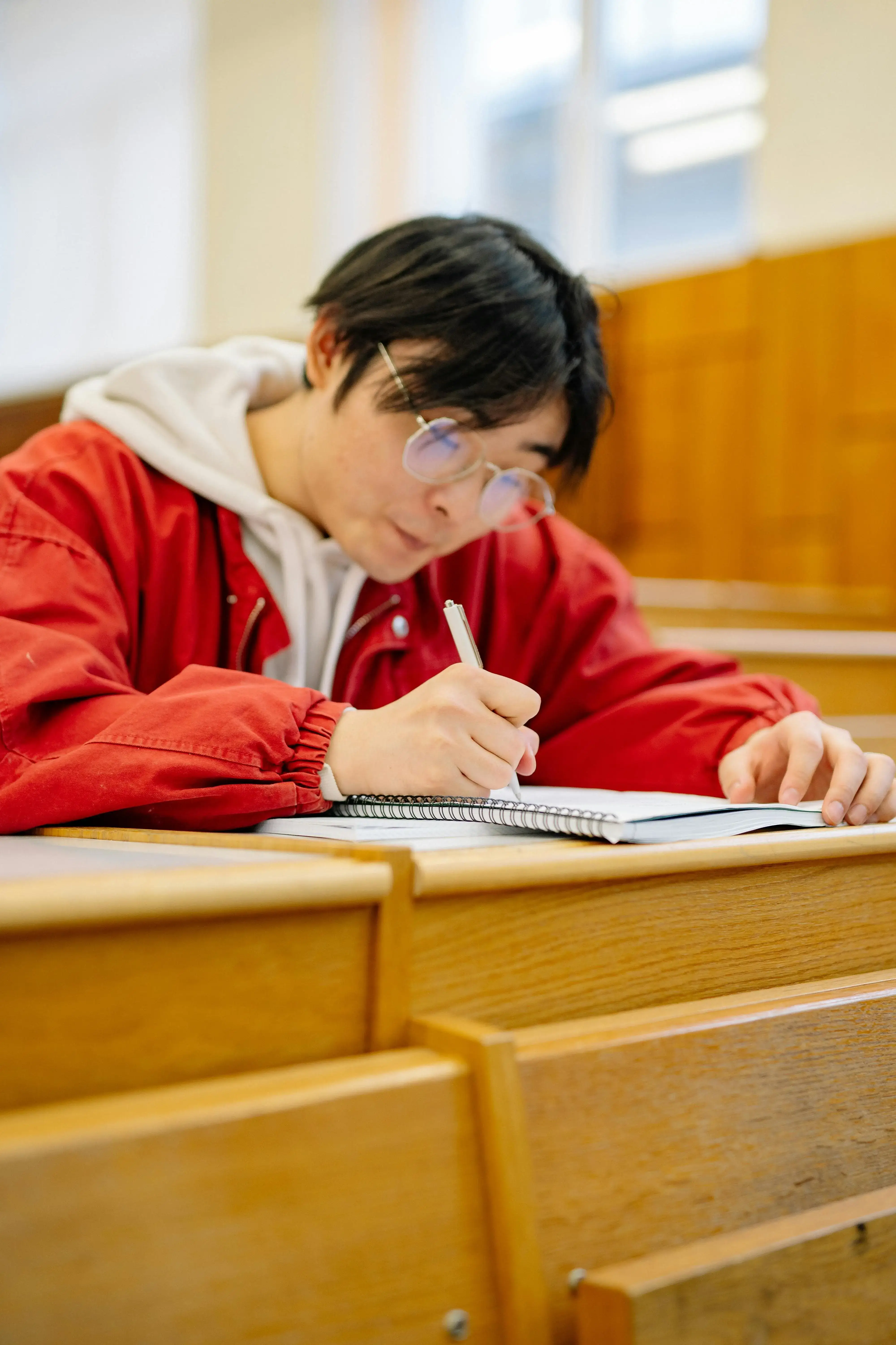 University student writing an essay